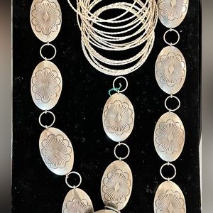 Vintage sterling silver (not plated) belt and bracelets. Belt is 39” in length.